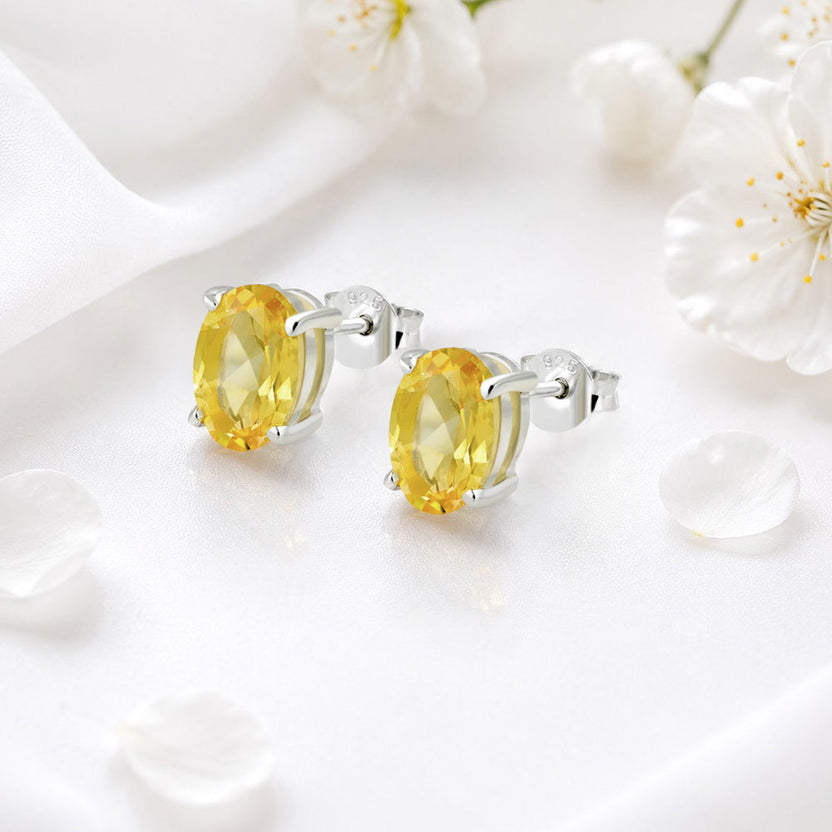 Aretes de botón de plata de ley con citrino ovalado de 5x7 mm engastado en garra