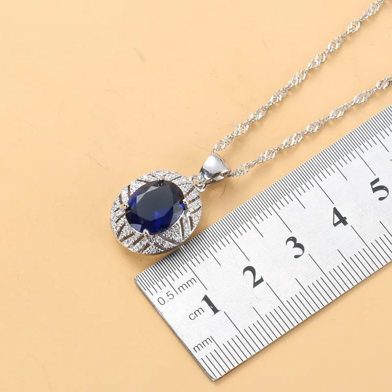 Smyckesset med safir för kvinnor, halsband med halo-hänge, örhängen och ring i 925 sterling silver, present med blå ädelsten för bröllopsfest