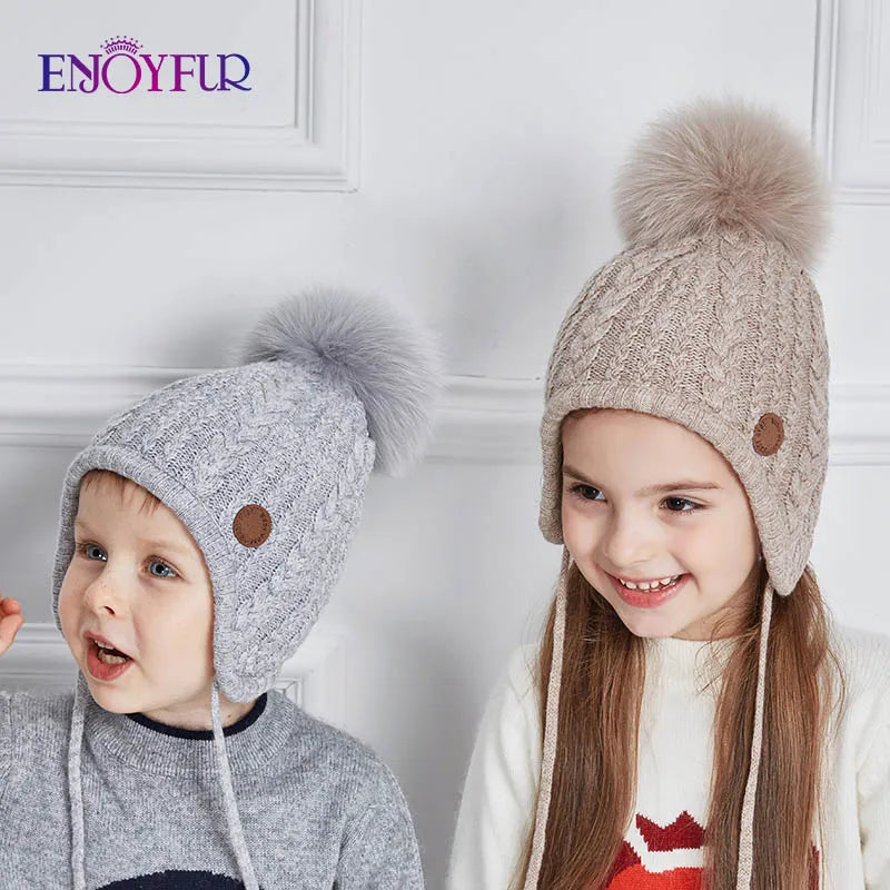 Gorro de punto de invierno ENJOYFUR para niños y niñas con pompón de piel de zorro natural, gorro cálido y grueso con orejeras para bebé