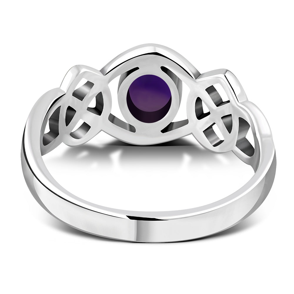 Anillo de plata con piedra amatista cabujón y nudo celta