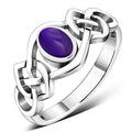 Anillo de plata con piedra amatista cabujón y nudo celta
