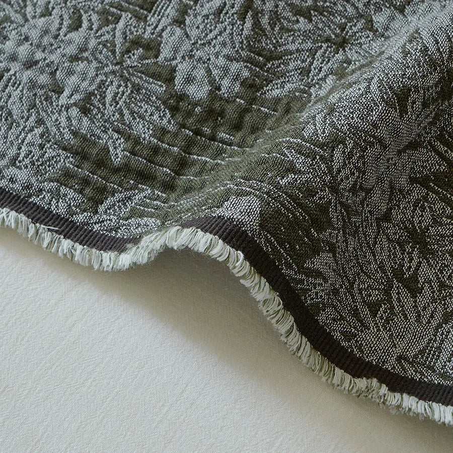 Manta con borlas de jacquard de algodón teñido en hilo 140x190 cm