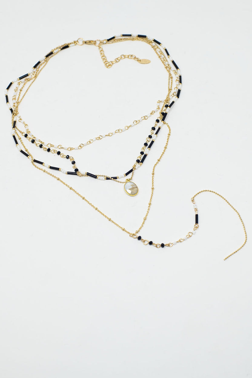 Gold 4 in 1 Necklace With Black and White Beads